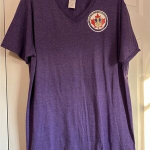 Women’s purple V-Neck T-Shirt with “Crown Jewels of Canada Society” crest.